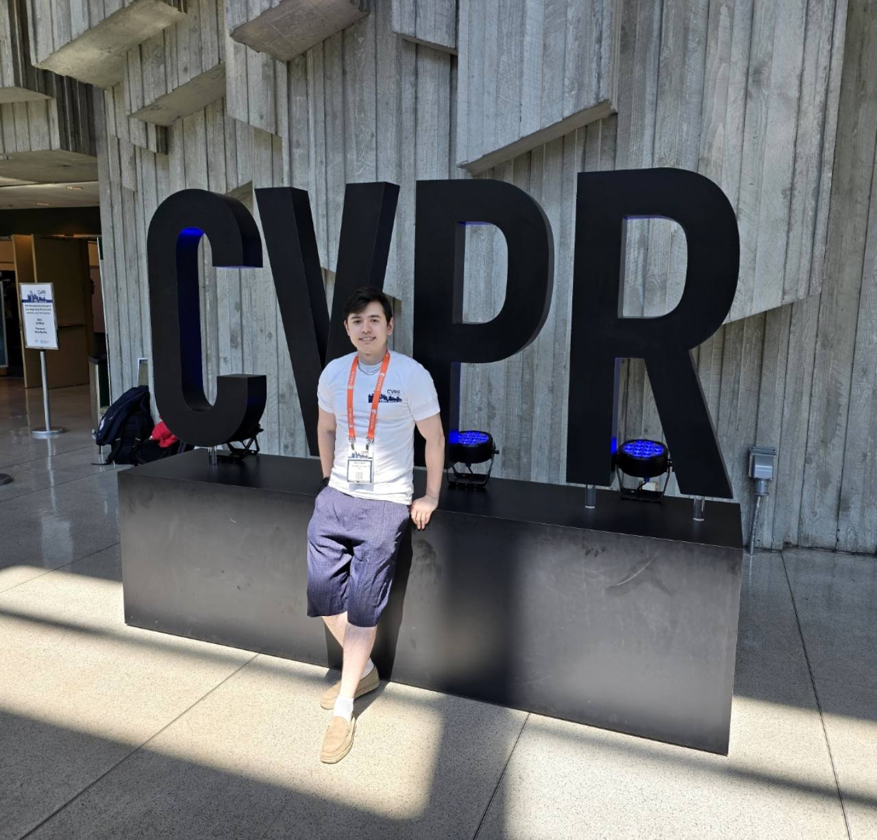 Quentin Herau standing beside the CVPR sign.